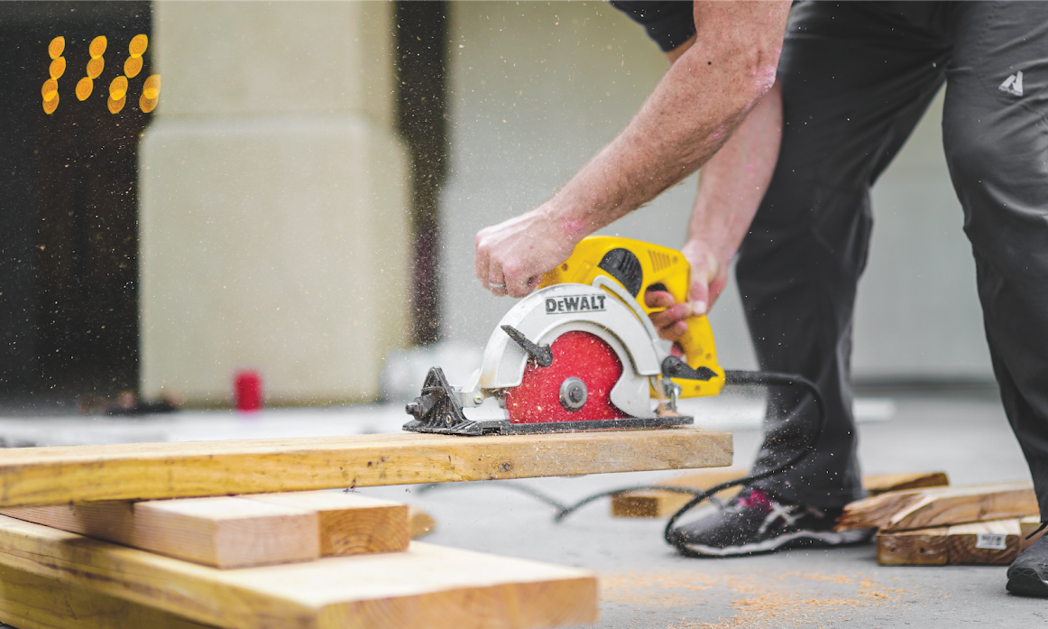 Image of carpenter cutting wood.