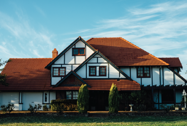 Image of a self build house. House is in the traditional black and with revival architecture style with a modern look and feel.