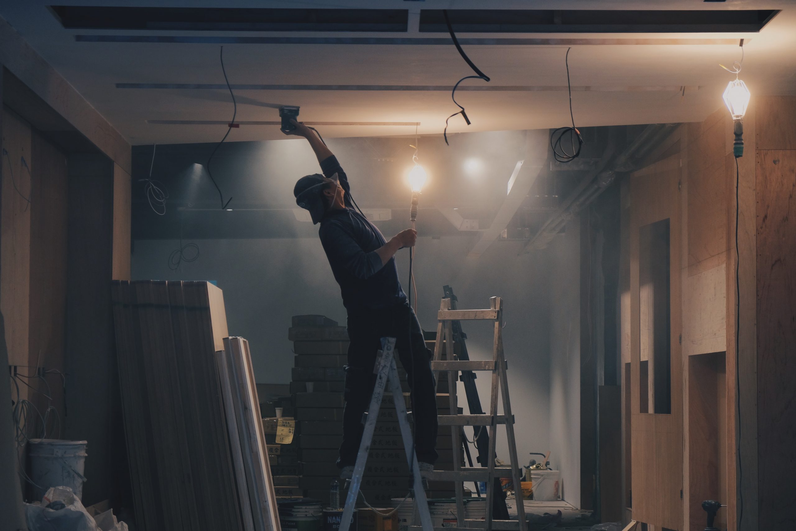 image of tradesman working on house.